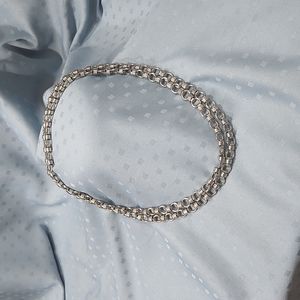 Necklace. Silver-tone infinity knot design